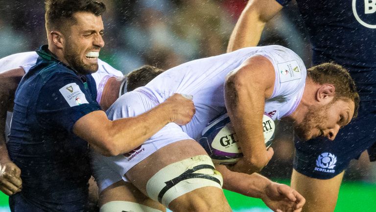 England’s Sam Underhill is tackled by Scotland’s Adam Hastings