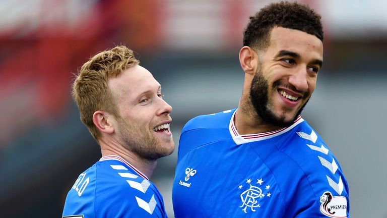 Scott Arfield celebrates with Connor Goldson after making it 4-1 to Rangers