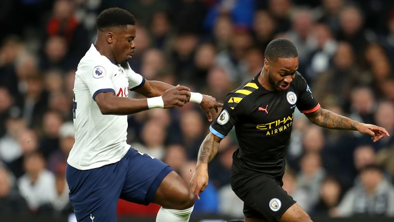 Raheem Sterling looks to beat Serge Aurier for pace down City's left side