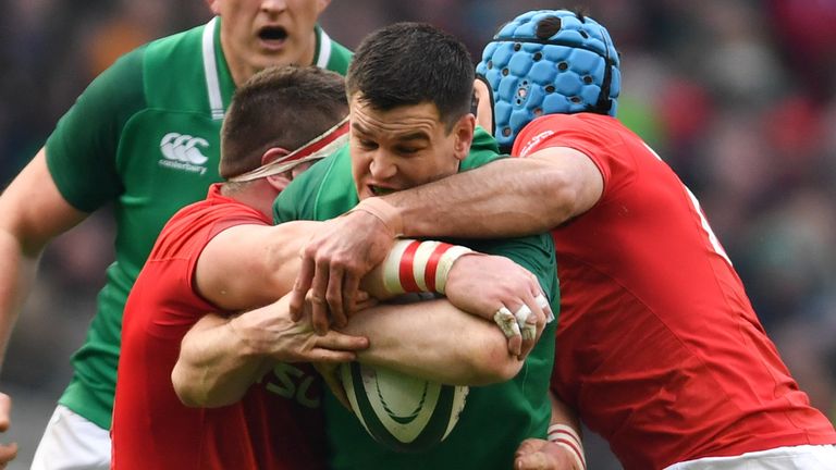24 February 2018; Jonathan Sexton of Ireland is tackled by Wyn Jones, left, and Justin Tipuric of Wales during the NatWest Six Nations Rugby Championship match between Ireland and Wales at the Aviva Stadium in Dublin. Photo by Ramsey Cardy/Sportsfile