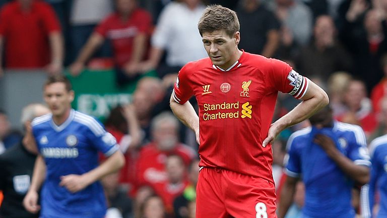 Steven Gerrard looks on after the first Chelsea goal against Liverpool in the Premier League meeting at Anfield in April 2014
