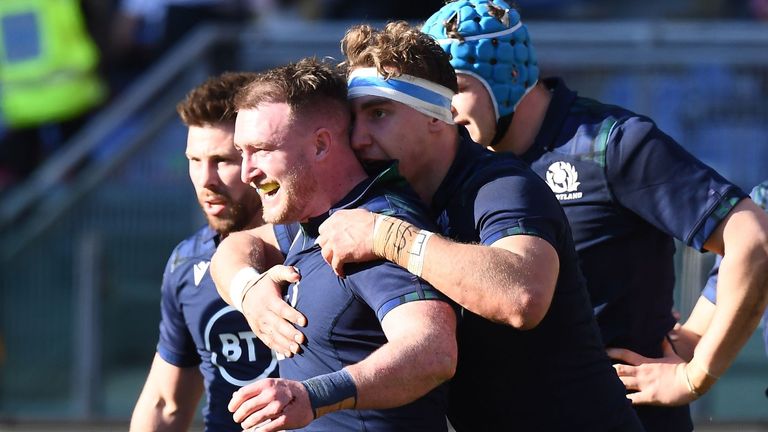 Scotland's full back Stuart Hogg (C) celebrates after scoring a try during the Six Nations international rugby union match between Italy and Scotland at the Olympic stadium in Rome on February 22, 2020.