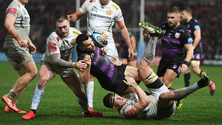 GLOUCESTER, ENGLAND - FEBRUARY 14: Tom Marshall of Gloucester Rugby is tackled by Stuart Hogg of Exeter Chiefs during the Gallagher Premiership Rugby match between Gloucester Rugby and Exeter Chiefs at Kingsholm Stadium on February 14, 2020 in Gloucester, England. (Photo by Harry Trump/Getty Images)