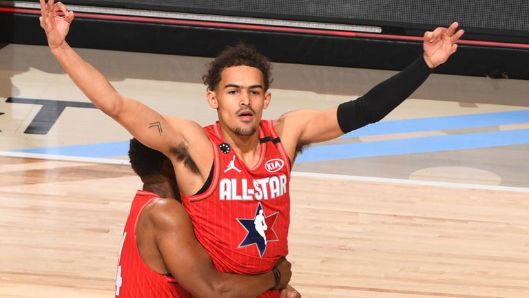 Trae Young celebrates after draining a halfcourt buzzer-beater in the All-Star Game