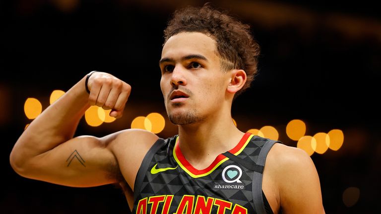 Trae Young flexes after making a play against the Knicks