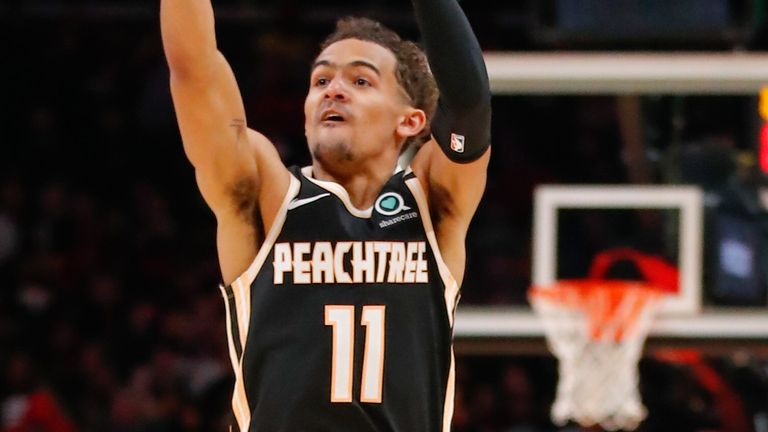 Trae Young launches a three-pointer en route to a career-best 50 points