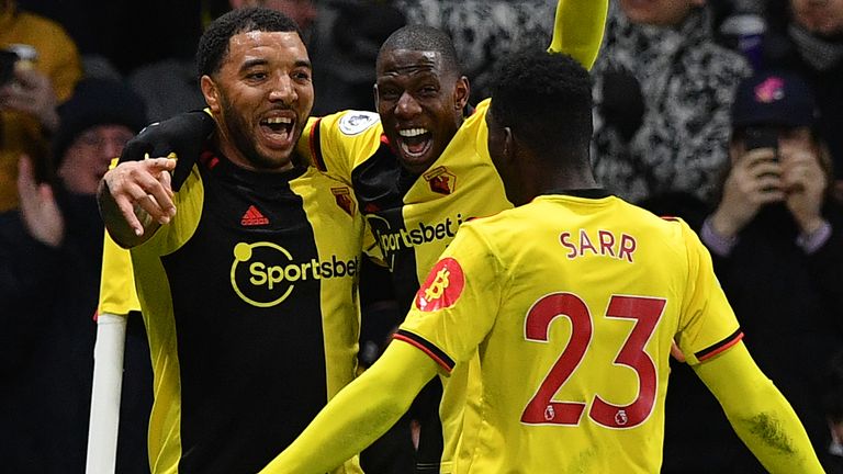 Troy Deeney celebrates his goal with Abdoulaye Doucoure and Ismaila Sarr