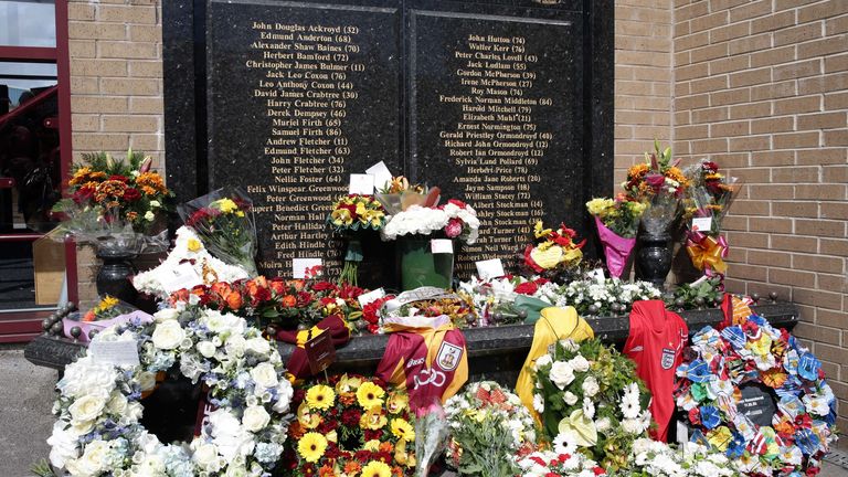 Floral tributes are laid at the Valley Parade Fire Memorial on the thirtieth anniversary of the Valley Parade fire during the Sky Bet League One match between Bradford City and Barnsley at Coral Windows Stadium on April 25, 2015 in Bradford, England. (Photo by Clint Hughes/Getty Images).