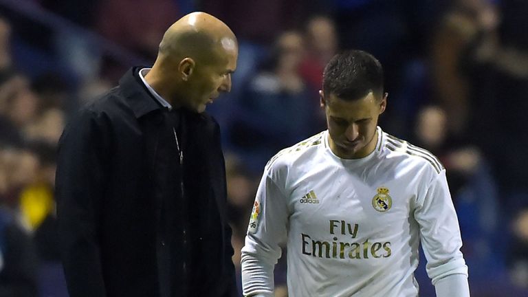 Zinedine Zidane checks on Eden Hazard as he exits the pitch against Levante