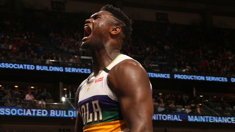 Zion Williamson celebrates after scoring with a dunk against Milwaukee