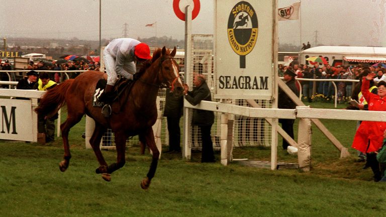 PA NEWS PHOTO 6/4/91  "SEAGRAM" RIDDEN BY NIGEL HAWKE PASSES THE POST AT AINTREE TO WIN THE 1991 GARND NATIONAL