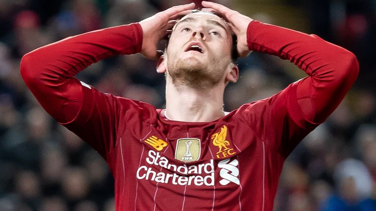 Andy Robertson cuts a dejected figure after Atletico Madrid scored away goals in extra-time