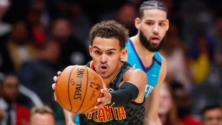 Trae Young fakes a pass during the Atlanta Hawks&#39; double-overtime clash with the Charlotte Hornets