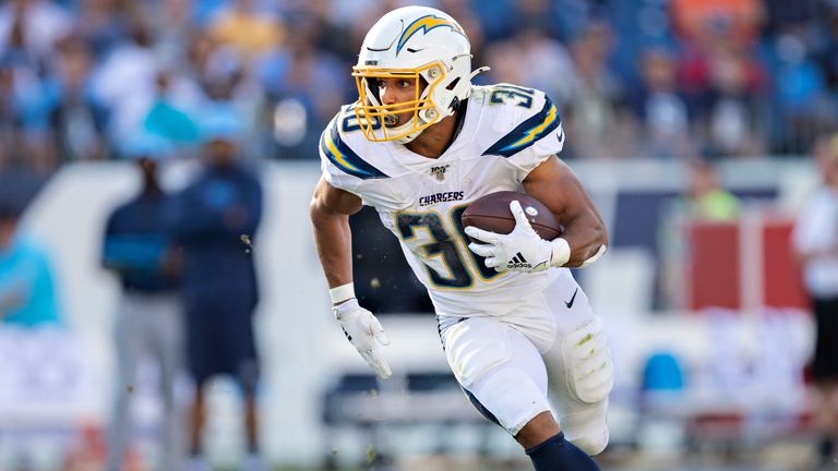 Austin Ekeler #30 of the Los Angeles Chargers runs the ball during a game against the Tennessee Titans at Nissan Stadium on October 20, 2019 in Nashville, Tennessee. The Titans defeated the Chargers 23-20.
