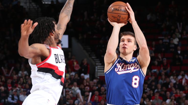 Bogdan Bogdanovic shoots the ball as the defender closes out against the Portland Trail Blazers