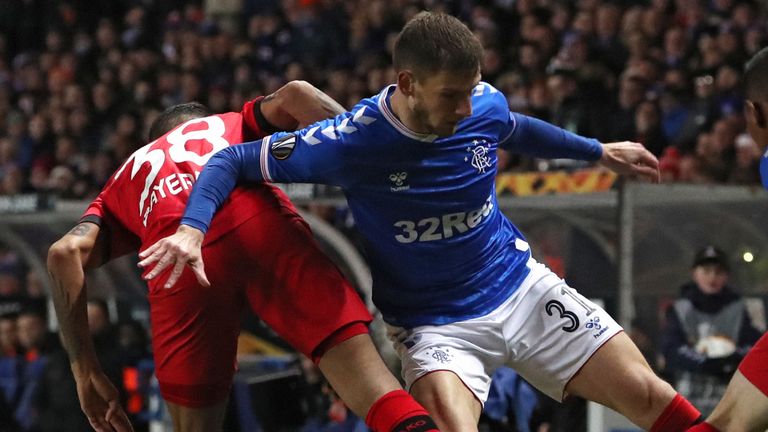 Bayer Leverkusen's Karim Bellarabi (left) and Rangers' Borna Barisic battle for the ball 