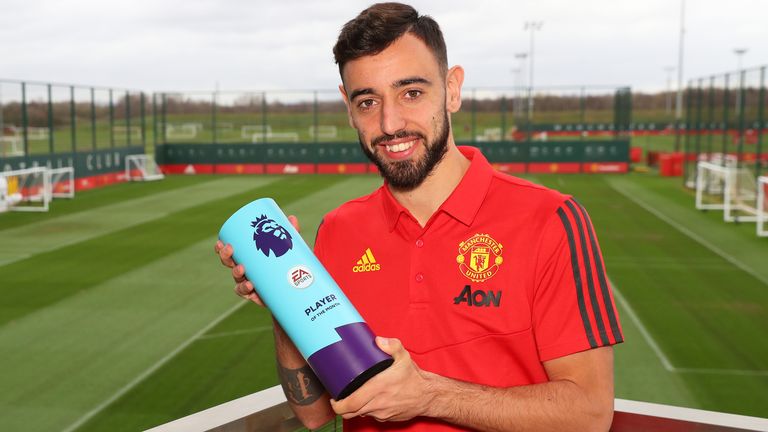 Bruno Fernandes is presented with the award for 'Premier League Player of the Month for February' at Carrington