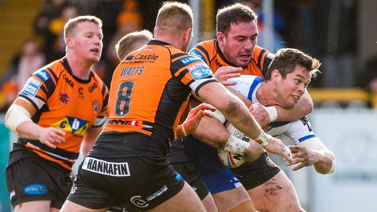 15/03/2020 - Rugby League - Betfred Super League - Castleford Tigers v St Helens - Mend-A-Hose Jungle, Castleford, England - St Helens' Louie McCarthy-Scarsbrook is tackled by Castleford's Grant Millington.