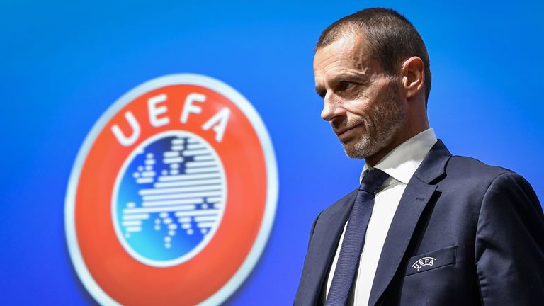 UEFA president Aleksander Ceferin walks past a sign with the UEFA logo after attending a press conference following a meeting of the executive committee at the UEFA headquarters, in Nyon, Switzerland on December 4, 2019. (Photo by Fabrice COFFRINI / AFP) (Photo by FABRICE COFFRINI/AFP via Getty Images)