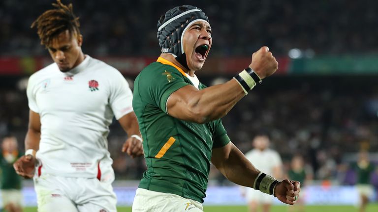 Cheslin Kolbe of South Africa celebrates after scoring the second try as Anthony Watson of England looks dejected during the Rugby World Cup 2019 Final between England and South Africa at International Stadium Yokohama on November 02, 2019 in Yokohama, Kanagawa, Japan. 