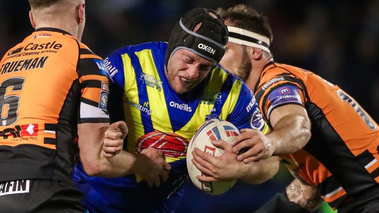 Picture by Alex Whitehead/SWpix.com - 06/03/2020 - Rugby League - Betfred Super League - Warrington Wolves v Castleford Tigers - Halliwell Jones Stadium, Warrington, England - Warrington's Chris Hill is tackled by Castleford's Cheyse Blair, Jake Truman and George Griffin.