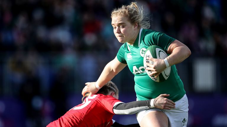 Ireland's Cliodhna Moloney comes up against Kayleigh Powell of Wales.