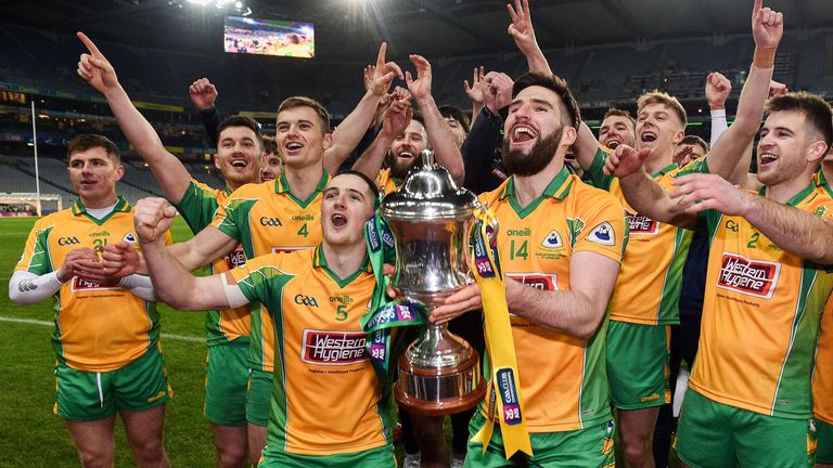 Corofin players celebrate with the Andy Merrigan Cup after their All-Ireland final win over Kilcoo in January
