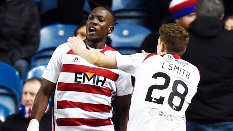 David Moyo celebrates with his team-mates after making it 1-0 to Hamilton against Rangers