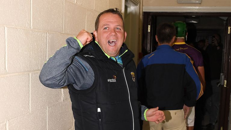 Wexford manager Davy Fitzgerald, who had to watch the game from high up in the stands, celebrates after the game