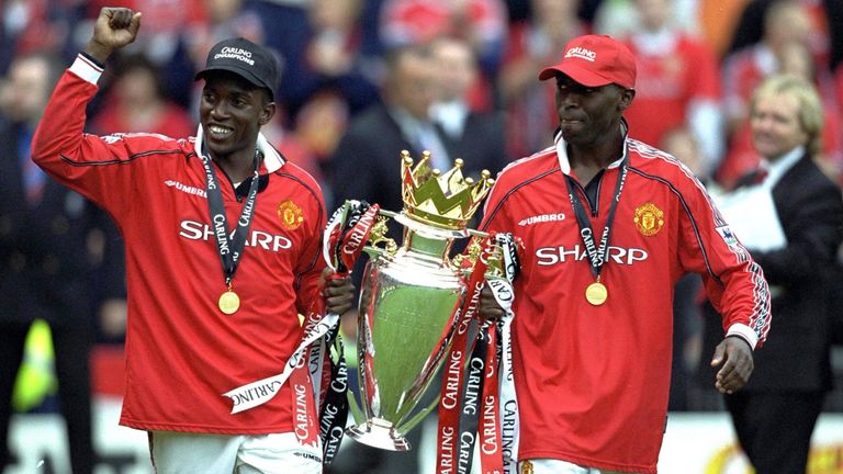 Dwight Yorke and Andy Cole celebrate Man Utd's Premiership title in 1999