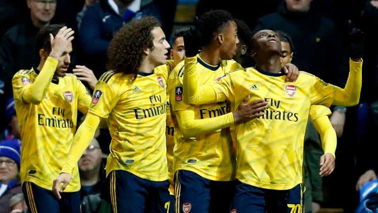 Arsenal's English striker Eddie Nketiah (R) celebrates scoring their second goal during the English FA Cup fifth round football match between Portsmouth and Arsenal at Fratton Park stadium in Portsmouth, southern England, on March 2, 2020. (Photo by Adrian DENNIS / AFP) / RESTRICTED TO EDITORIAL USE. No use with unauthorized audio, video, data, fixture lists, club/league logos or 'live' services. Online in-match use limited to 120 images. An additional 40 images may be used in extra time. No vid