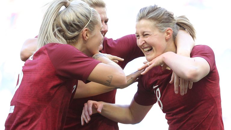 Ellen White celebrates her goal against Japan with defenders Rachel Daly