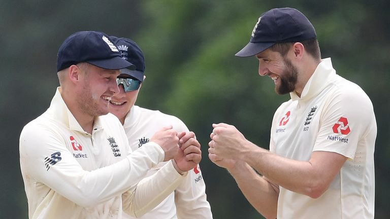 England pair Matt Parkinson (L) and Chris Woakes celebrate a wicket during their warm-up match against a Sri Lanka Board XI