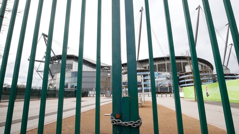 A view of locked gates outside the Etihad Stadium in Manchester. All Premier League football has been suspended in response to the Coronavirus pandemic