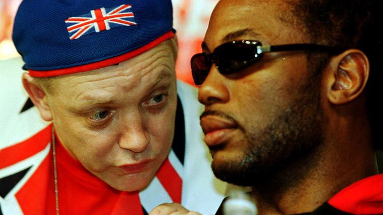 Boxing - WBC Heavyweight Championship - Lennox Lewis v Michael Grant - Madison Square Garden
Lennox Lewis listens to his rumoured, estranged Manager Frank Maloney at press conference after his second round victory over Michael Grant. 29 April 2000