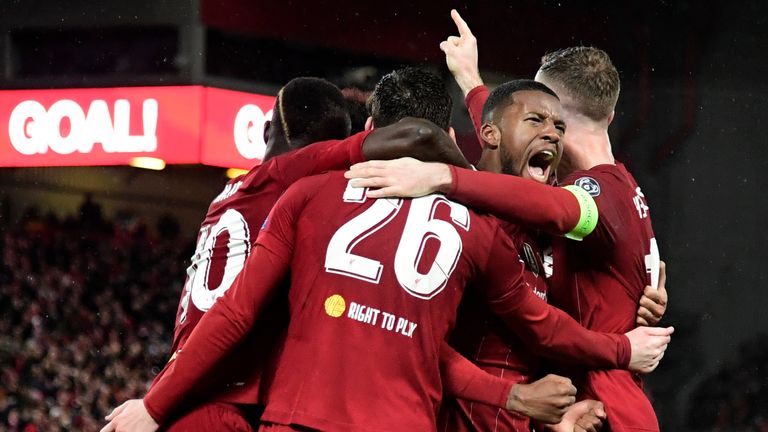 Liverpool players celebrate Gini Wijnaldum&#39;s first-half goal against Atletico Madrid