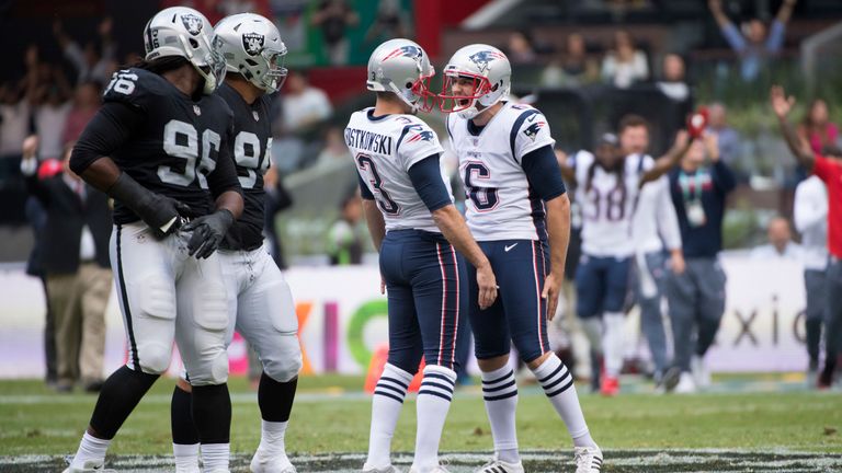 Punter Ryan Allen and Stephen Gostkowski of the New England Patriots celebrate a long field goal against of the Oakland Raiders at Estadio Azteca