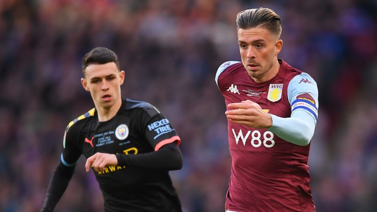 Jack Grealish takes on Phil Foden
