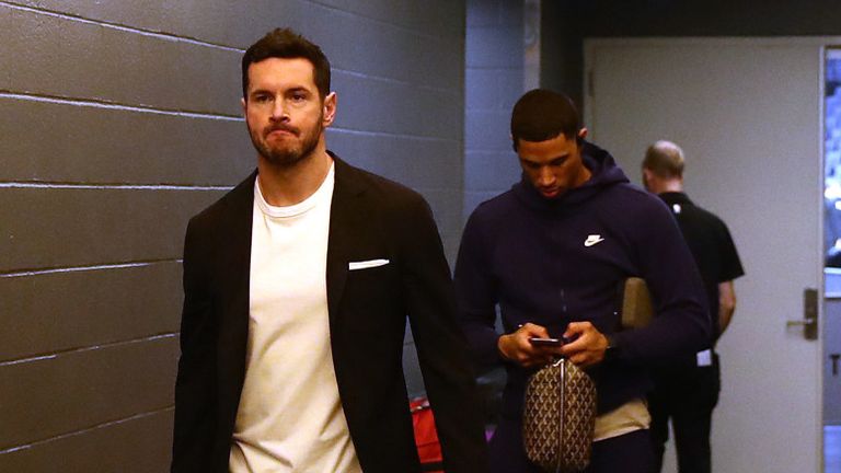 JJ Redick and his Pelicans team-mates leave the arena following the postponement of their game in Sacramento