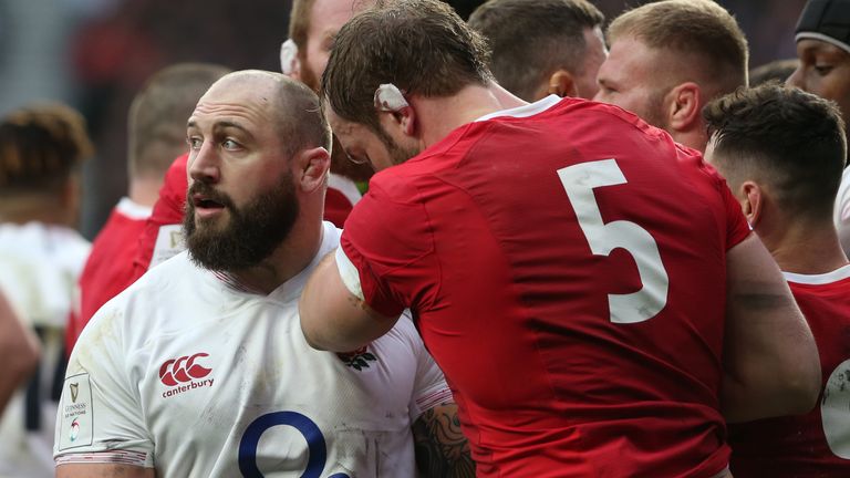 Alun Wyn-Jones looks down after Joe Marler grabs his groin during the Six Nations match between England and Wales at Twickenham
