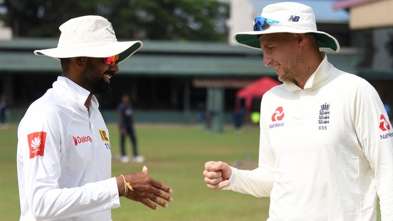 England captain Joe Root fist bumps SLC Board President's XI captain Lahiru Thirimanne rather than shake hands, as advised by the ECB due to fears over the spread of coronavirus