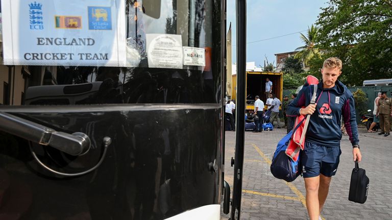 England captain Joe Root heads onto the team bus after his team's tour of Sri Lanka was postponed