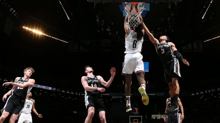 DeAndre Jordan of the Brooklyn Nets reaches for the ball during the game against the San Antonio Spurs