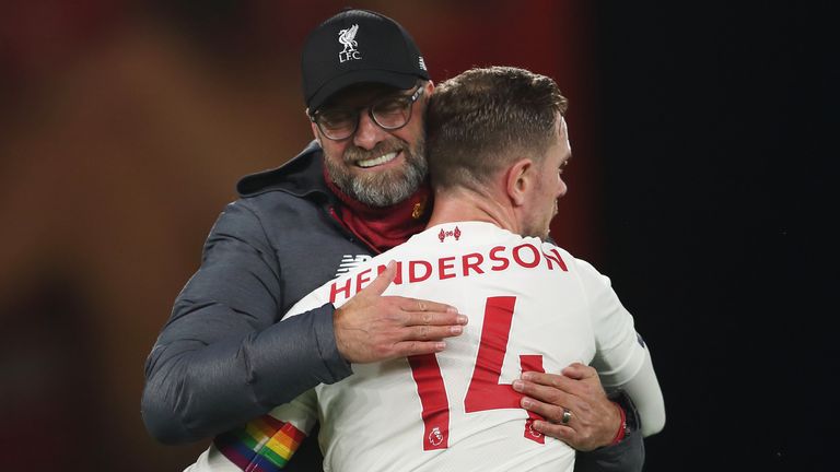 Jurgen Klopp and Jordan Henderson embrace