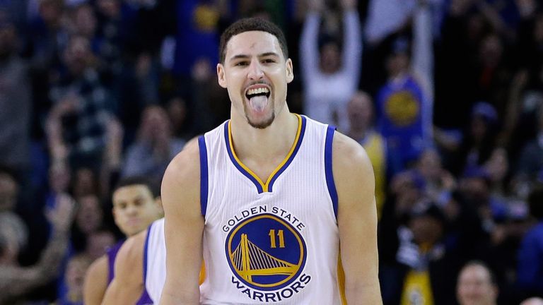Klay Thompson celebrates after draining a three-pointer against the Sacramento Kings