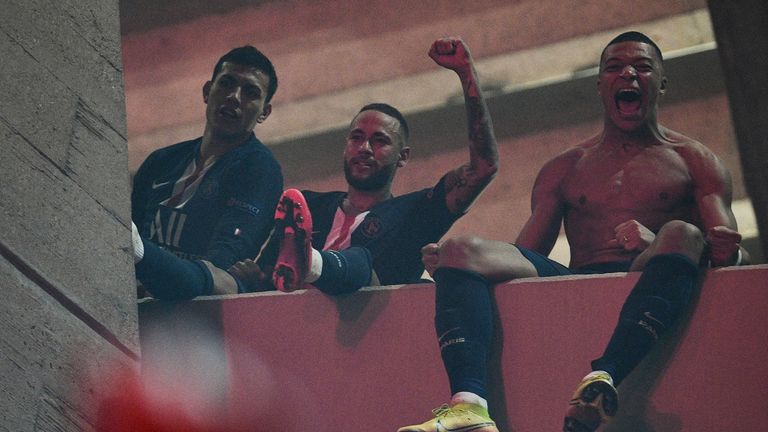 Neymar and Kylian Mbappe celebrate on a balcony with the fans outside the ground