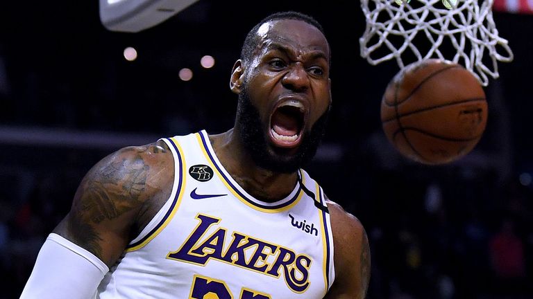 LeBron James celebrates after scoring and drawing a foul in the Lakers' win over the Clippers