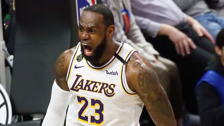 LeBron James roars in celebration after scoring for the Lakers