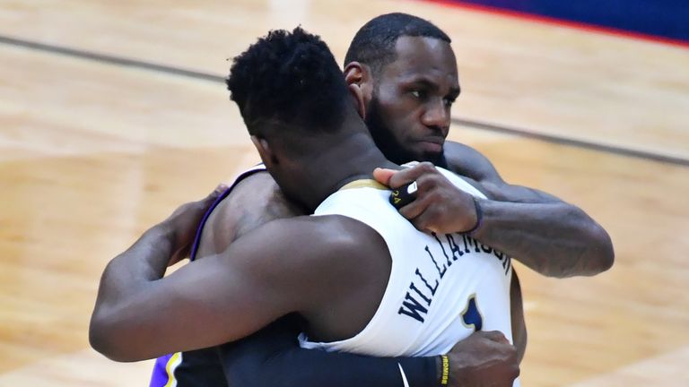 Zion Williamson and Lebron James embrace during the New Orleans Pelicans and LA Lakers game