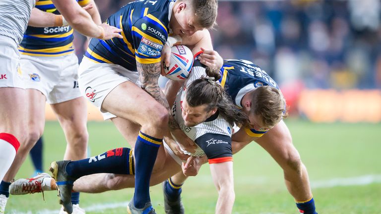 Toronto's Liam Kay is tackled by Leeds defenders Alex Mellor and Matt Prior